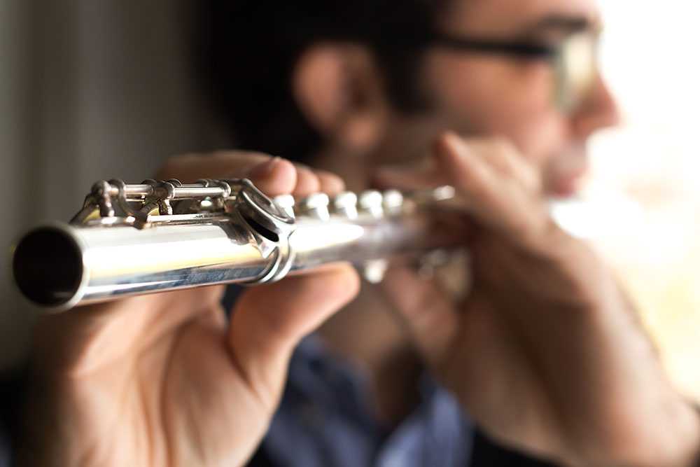 Adult flute player
