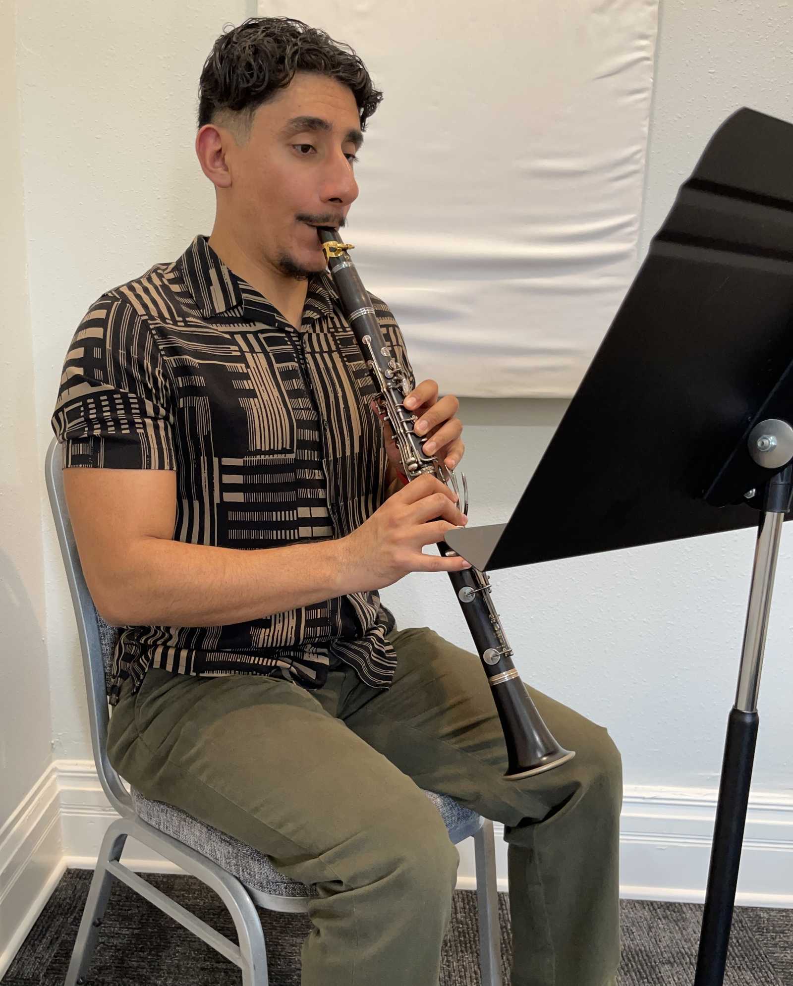 A man practicing the clarinet