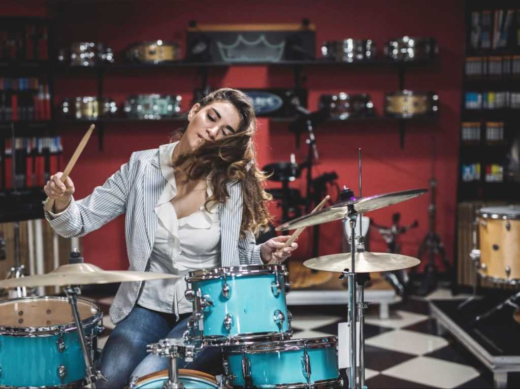 Girl jamming on drums