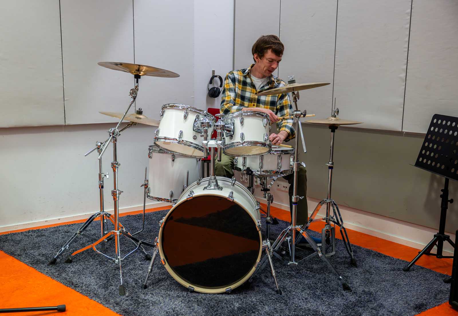 a man playing drums in a studio