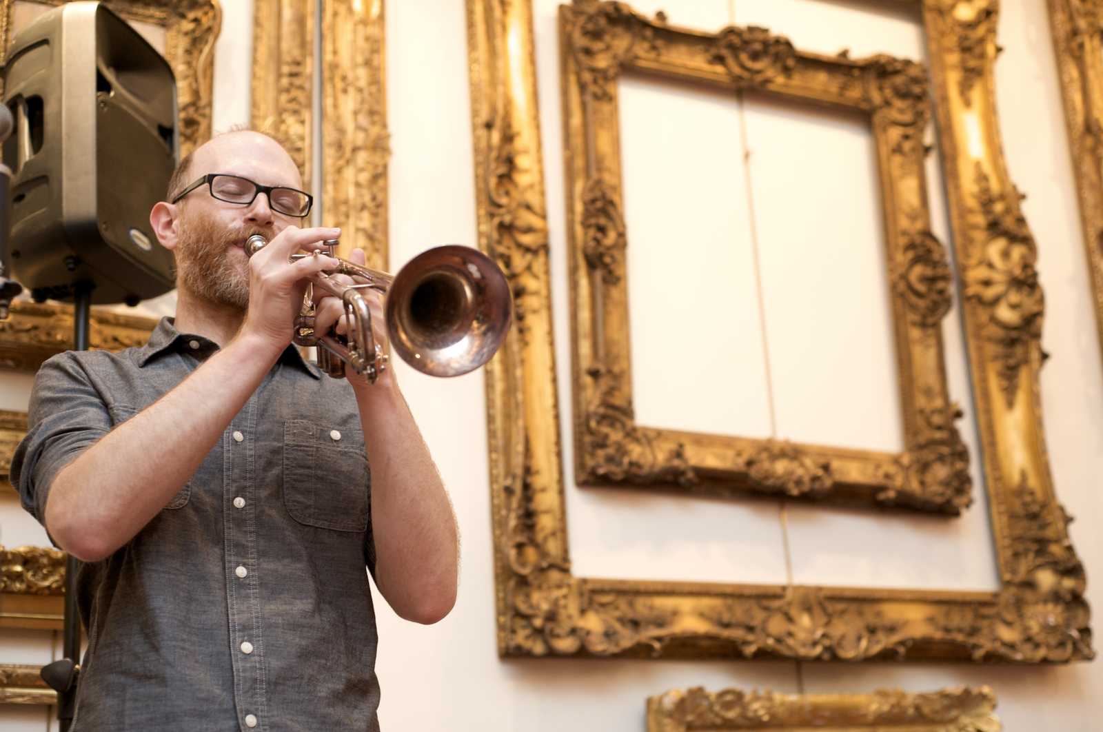 A man performing on the trumpet
