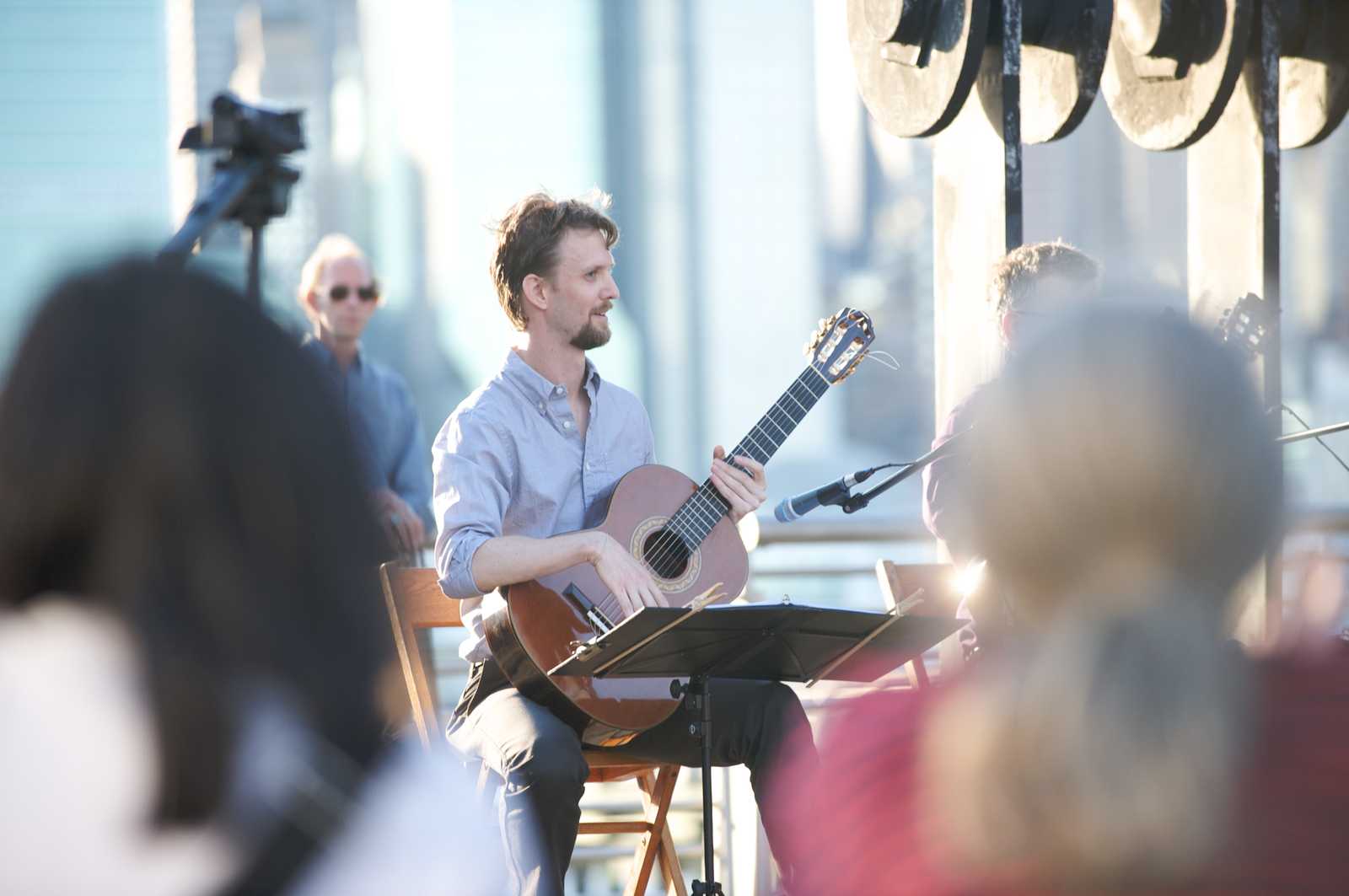 Jason Sagebiel performing at an outdoor concert
