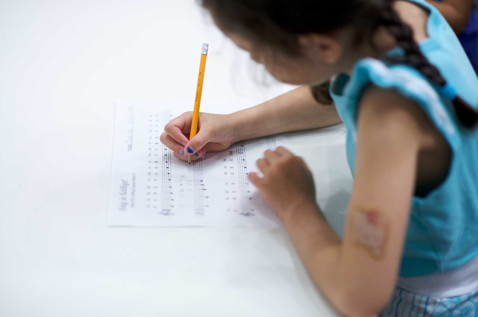 A child writing music at Sage Music