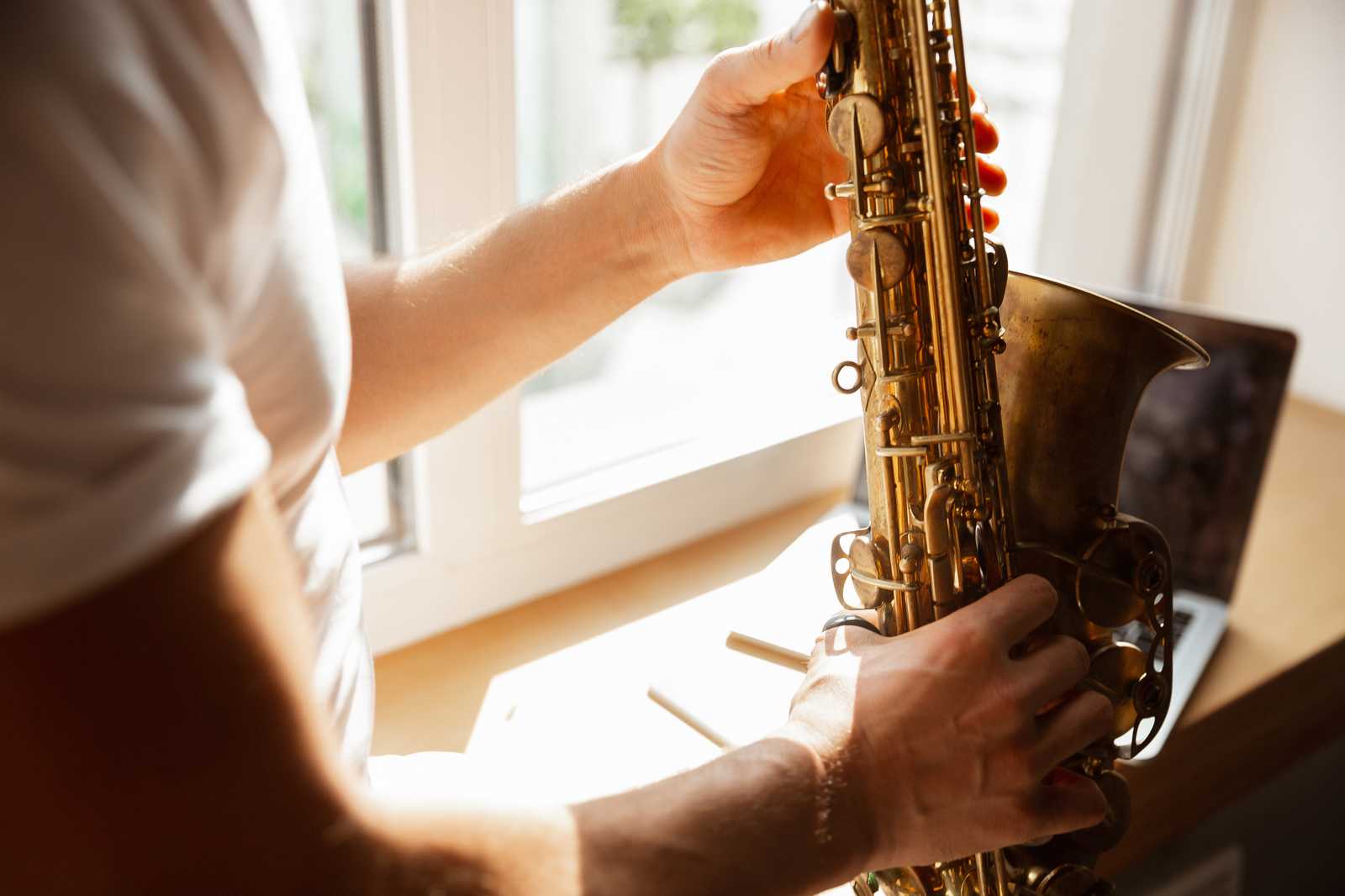 Man holding a saxophone