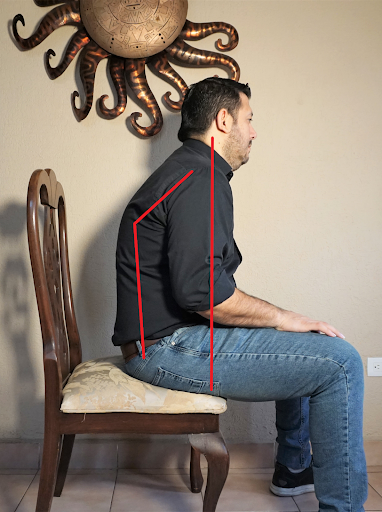 Poor seated posture for holding the guitar