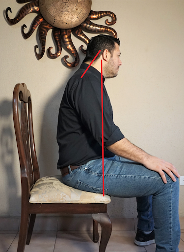 Poor seated posture for holding the guitar