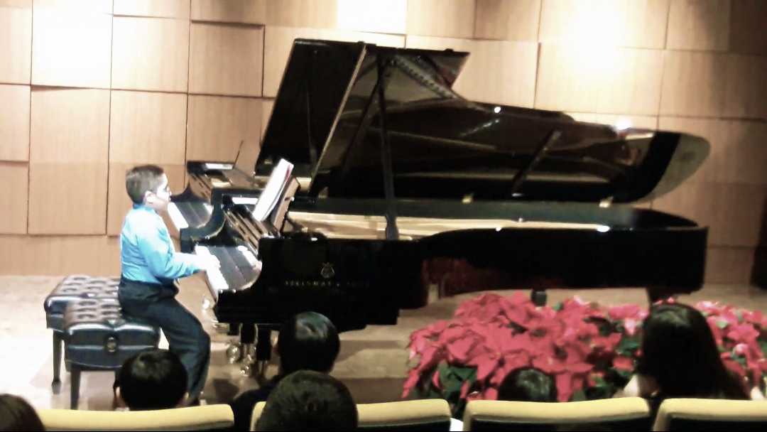 Roberto, performing as a young piano student