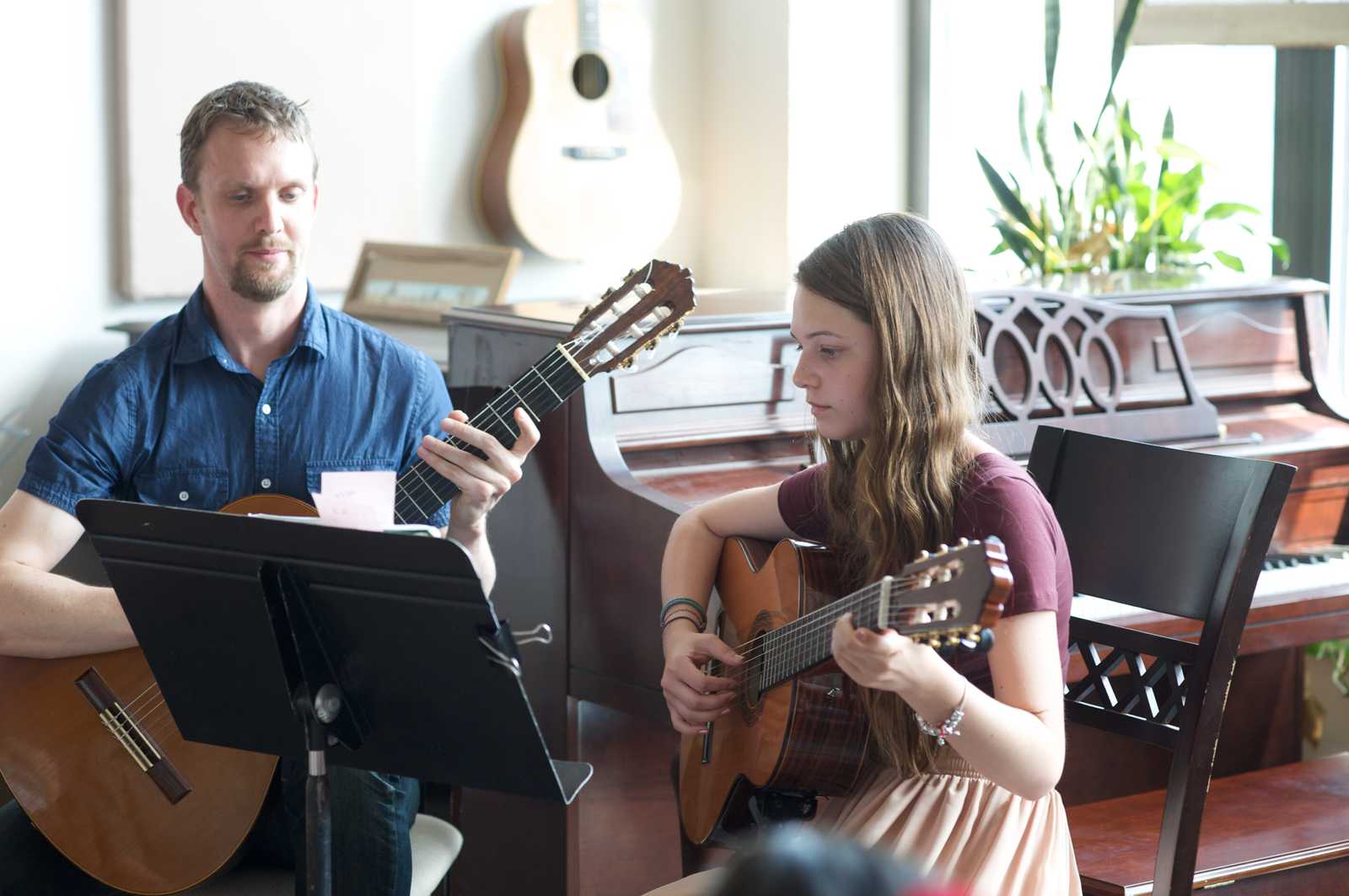 Teacher and student in guitar recital