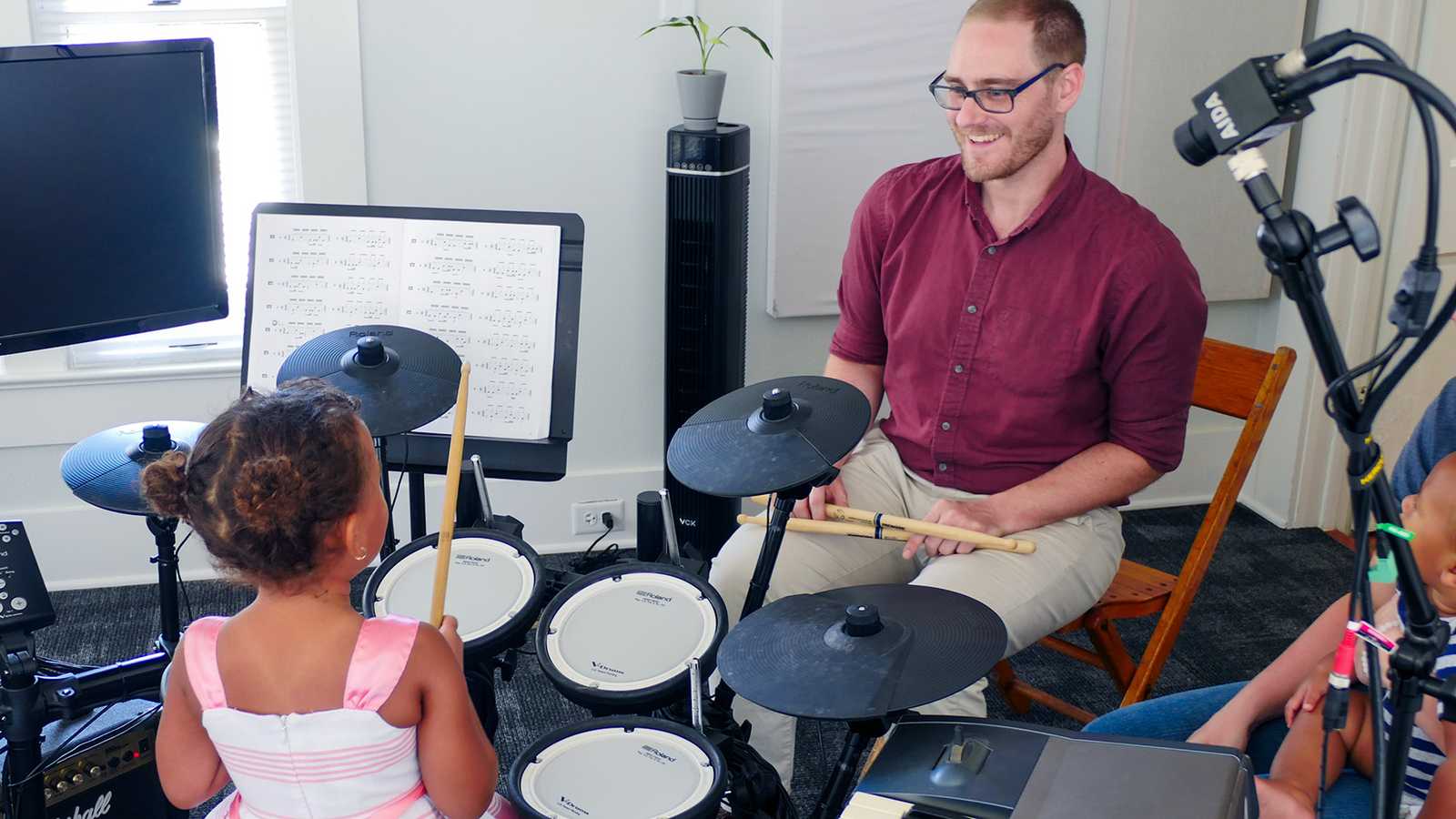 A music teacher giving a lesson