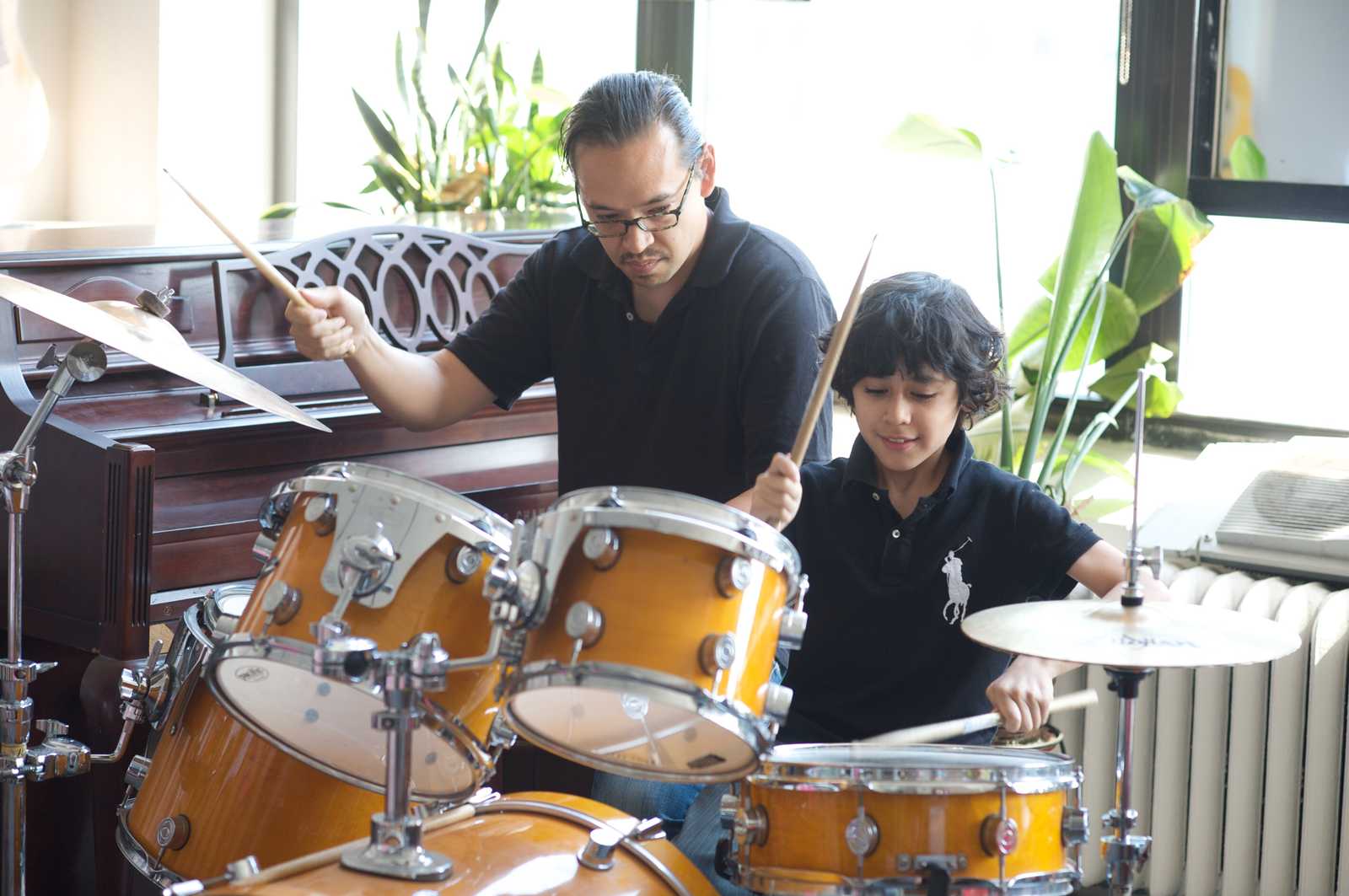 Sage drum teacher with student in recitals