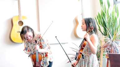 Sage Music teacher and student in a violin recital