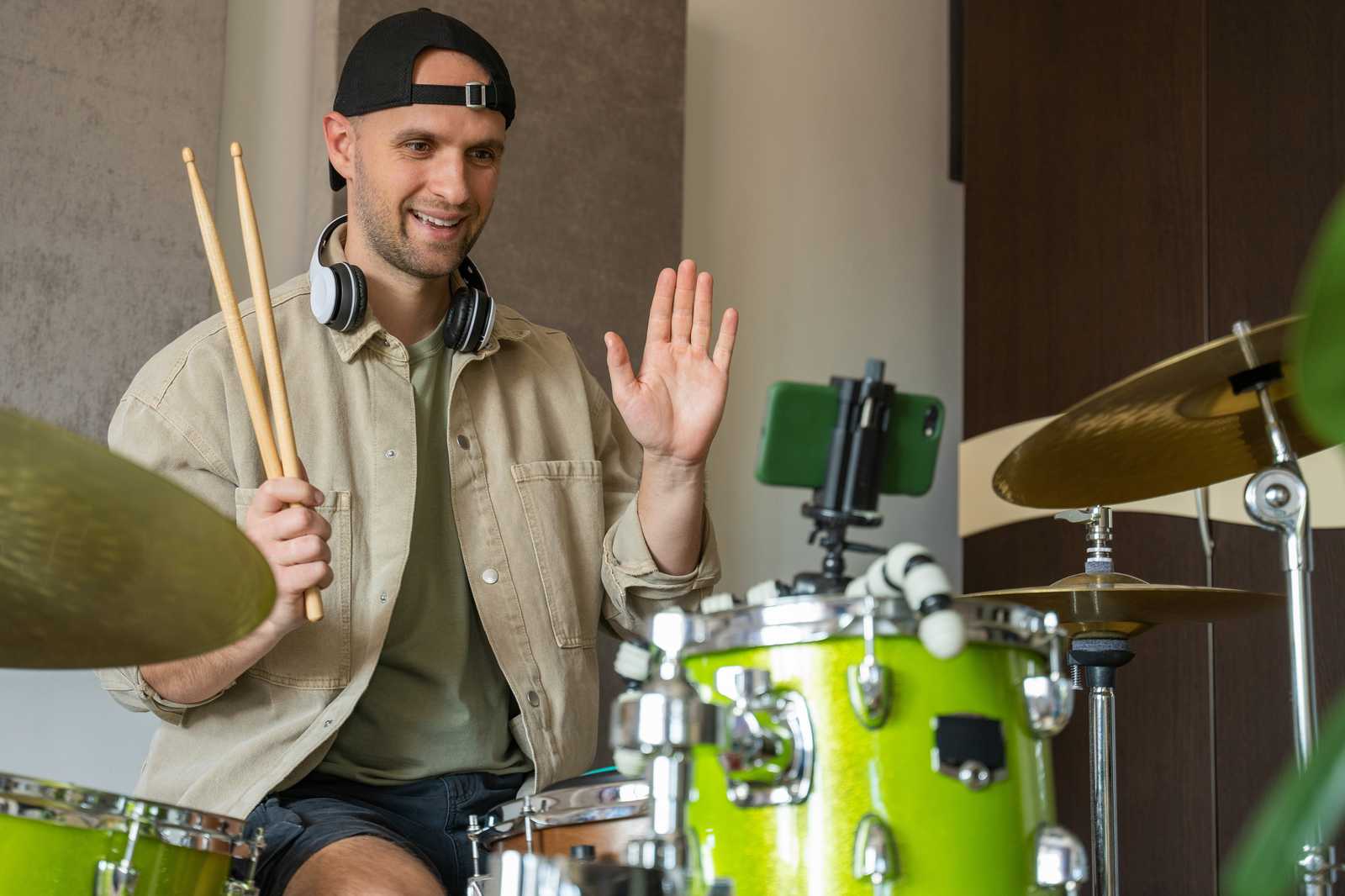 A student taking an online drum lesson