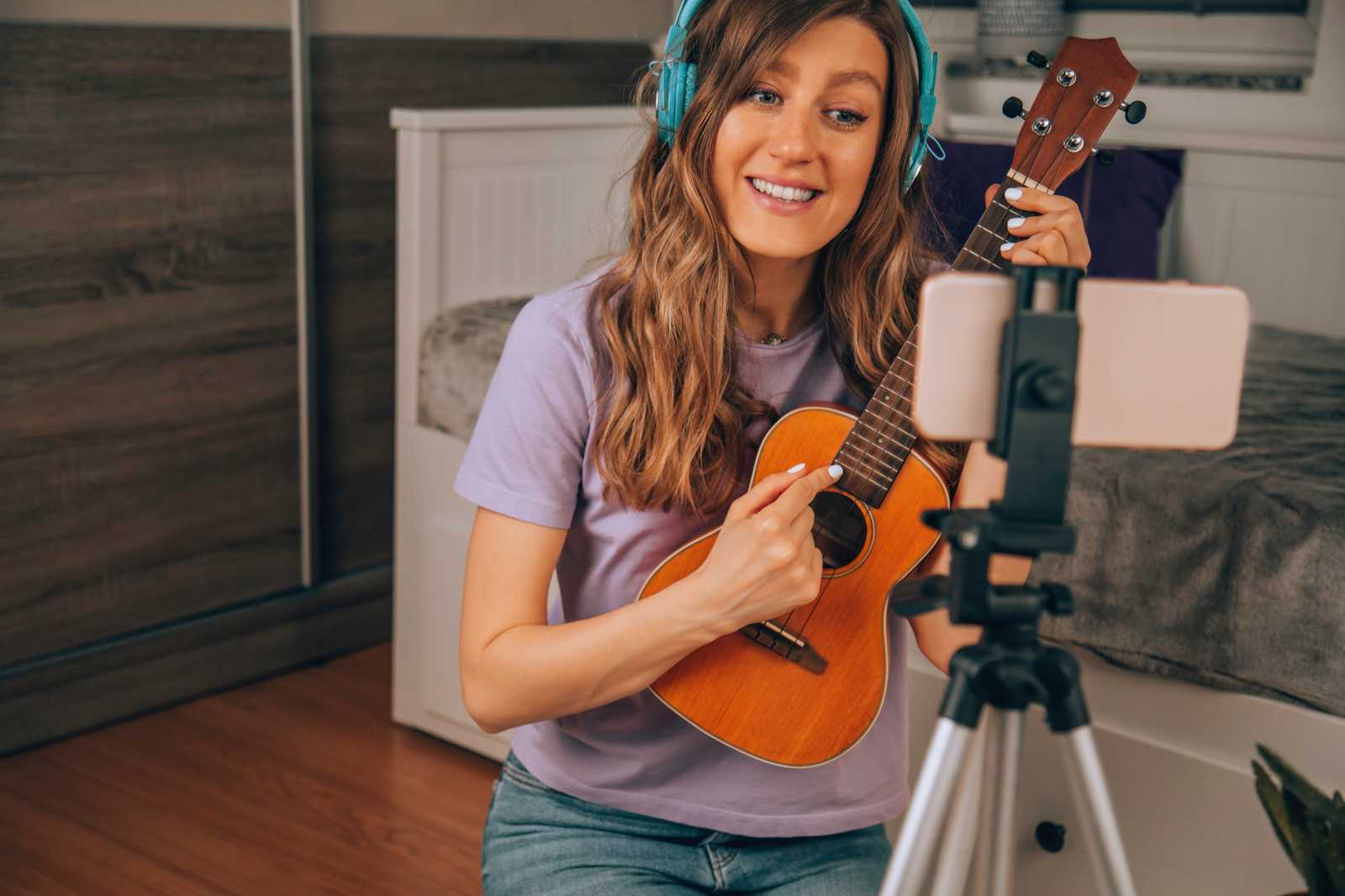 A woman demonstating the ukulele