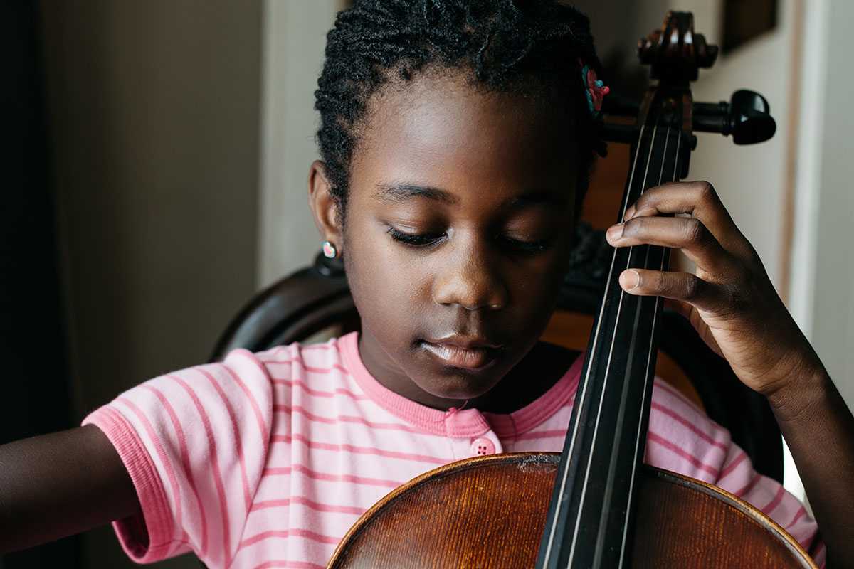 young girl playing the cello
