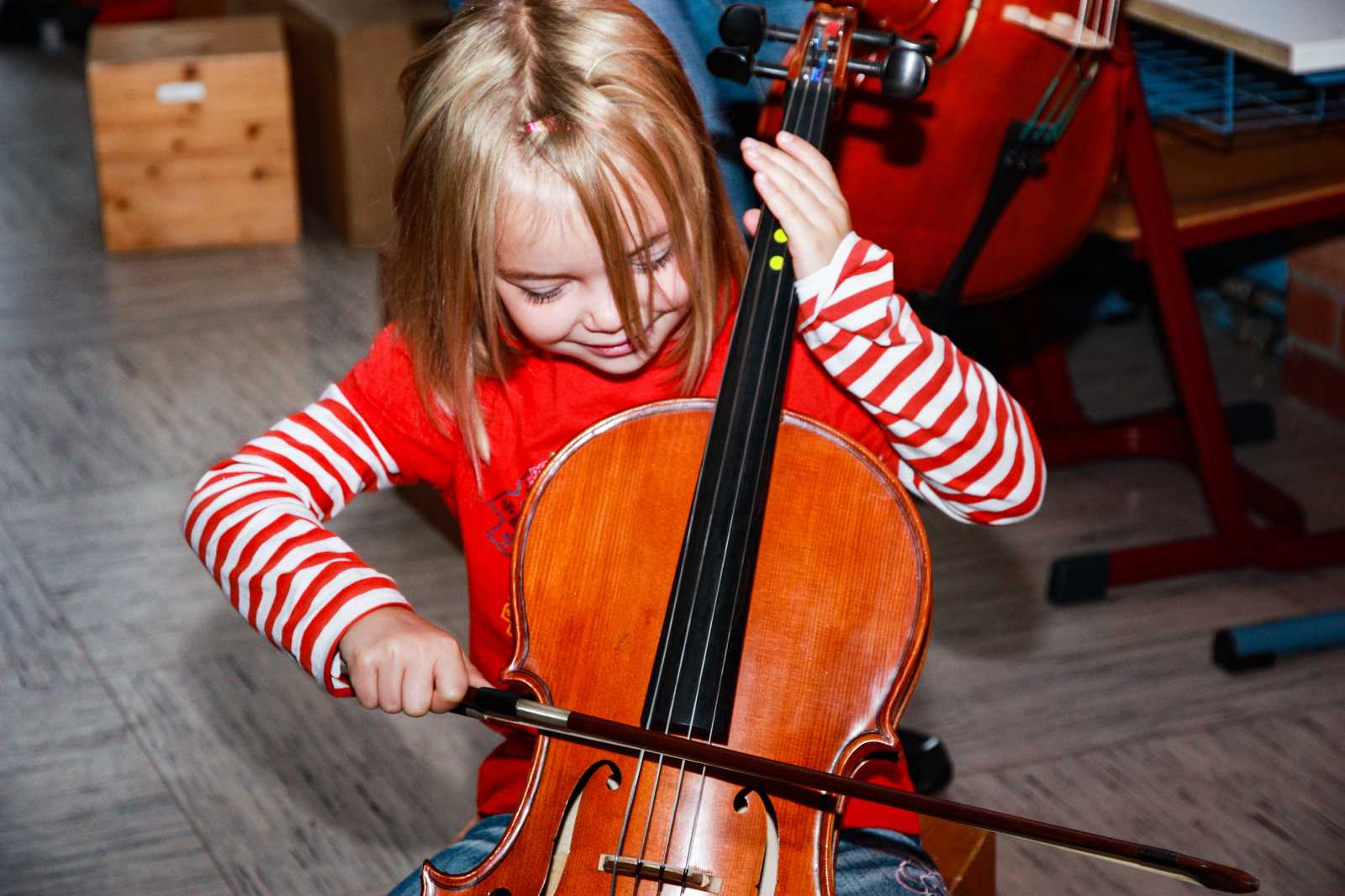 Cello teacher playing music
